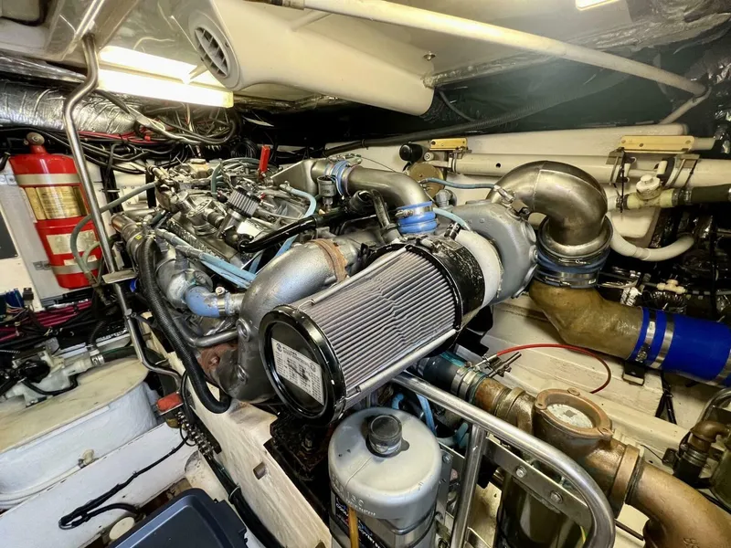 Slide: The Image of Engine room of 1997 Tiara Yachts 41, showcasing detailed mechanical components. - 27