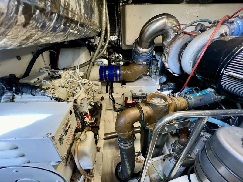 Slide: The Image of Engine room of 1997 Tiara Yachts 41, showcasing complex machinery and components. - 30