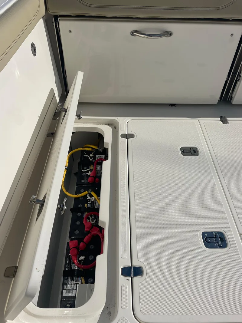 Slide: The Image of 2020 Pursuit 385 Offshore boat battery compartment and storage area. - 13