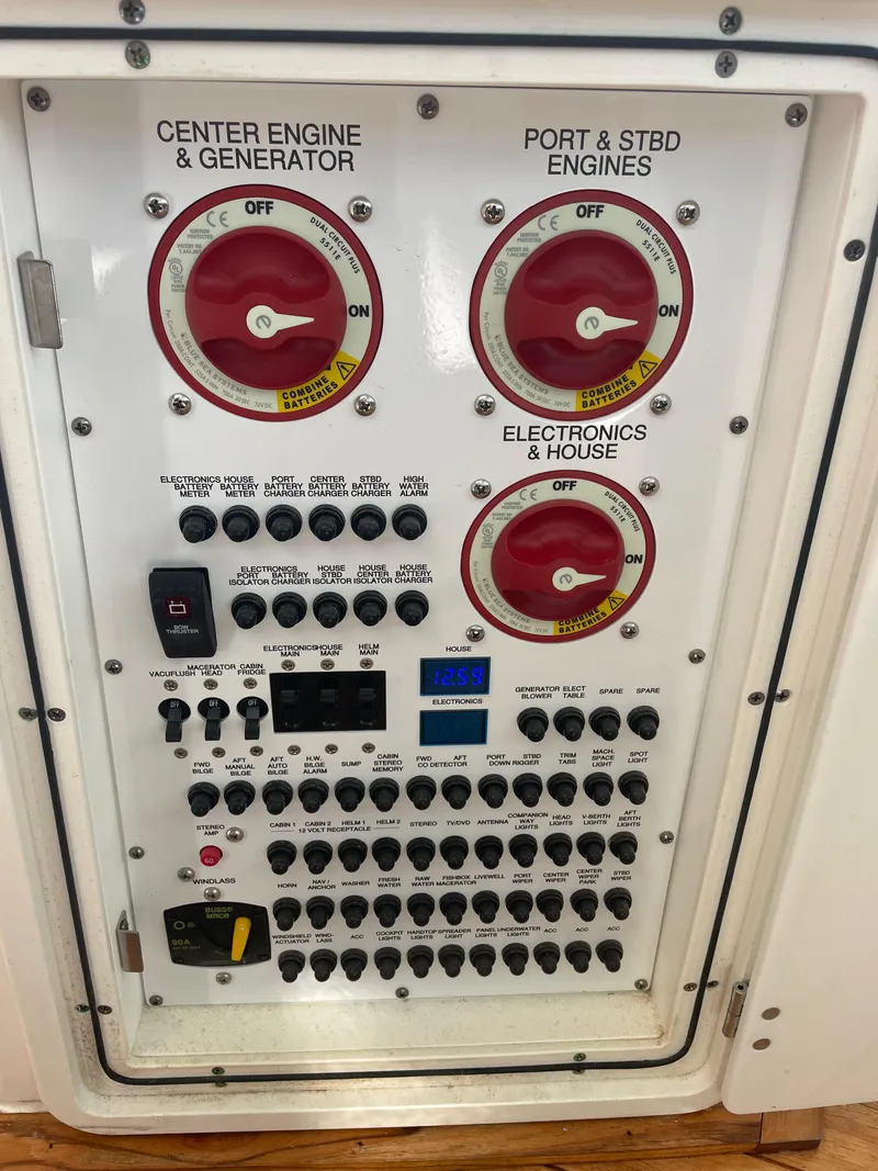 Slide: The Image of Control panel of a 2020 Pursuit 385 Offshore boat with engine and electronics switches. - 25