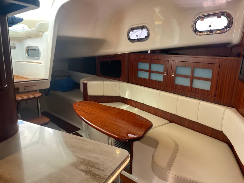 Slide: The Image of Luxurious interior of 2020 Pursuit 385 Offshore yacht with elegant wood and leather seating. - 31