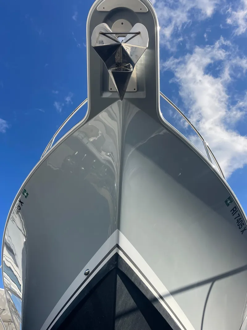 Slide: The Image of 2020 Pursuit 385 Offshore boat bow against blue sky. - 5