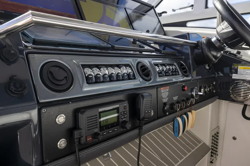 Slide: The Image of 2019 Formula 430 Super Sport Crossover dashboard with controls and navigation equipment. - 36