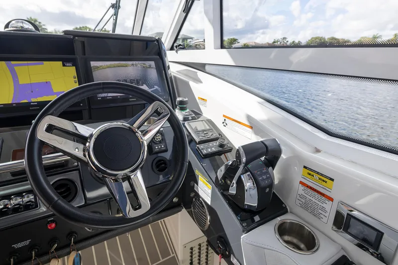 Slide: The Image of 2019 Formula 430 Super Sport Crossover helm with advanced navigation controls and steering wheel. - 38