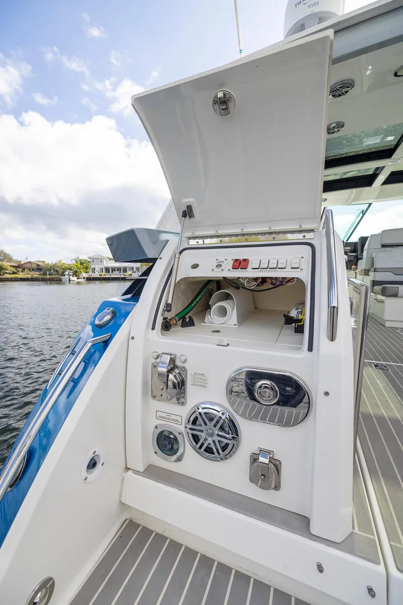 Slide: The Image of 2019 Formula 430 Super Sport Crossover boat control panel by the water. - 7