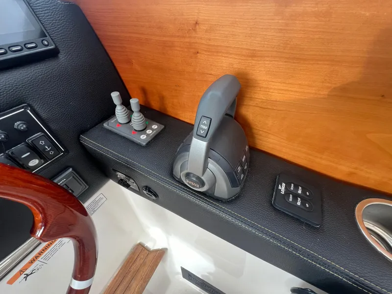 Slide: The Image of 2021 Cutwater C28 boat controls with joystick and throttle lever. - 18