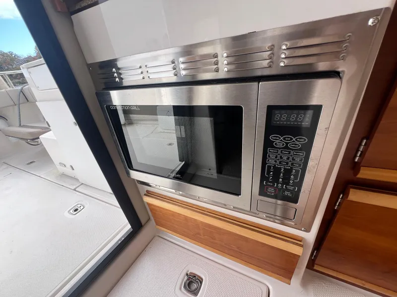 Slide: The Image of Stainless steel microwave in 2021 Cutwater C28 boat interior. - 21