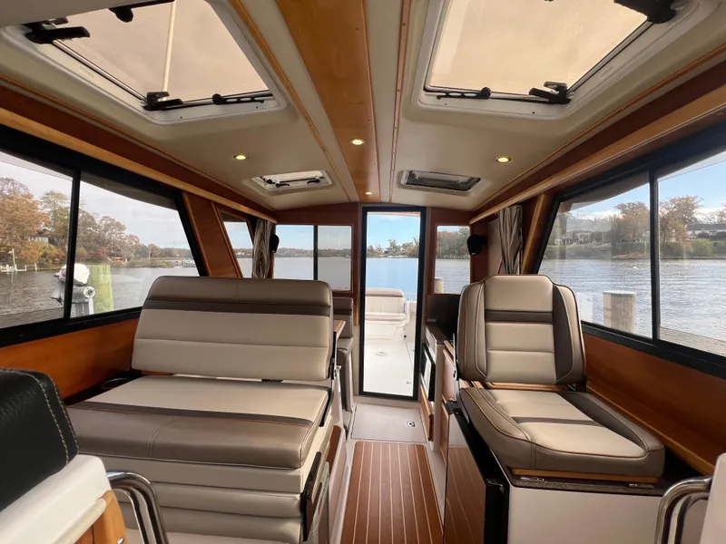 Slide: The Image of Interior of 2021 Cutwater C28 boat with luxurious seating and scenic water view. - 30