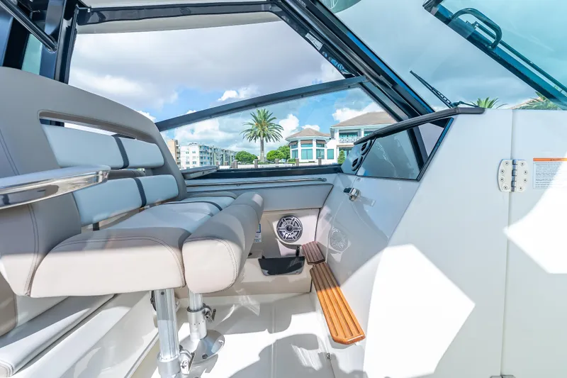 Slide: The Image of 2025 Boston Whaler 330 Vantage interior with luxurious seating and modern design. - 17