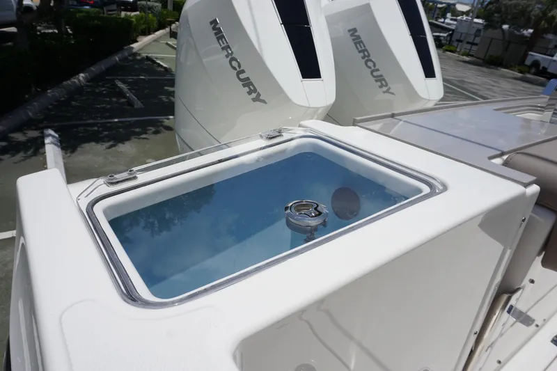 Slide: The Image of 2025 Boston Whaler 330 Vantage boat with Mercury engines and livewell. - 30