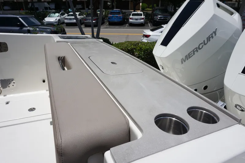 Slide: The Image of 2025 Boston Whaler 330 Vantage boat interior with Mercury engines and cup holders. - 32