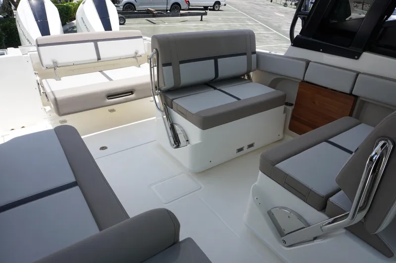 Slide: The Image of 2025 Boston Whaler 330 Vantage boat interior with gray seating and modern design. - 35