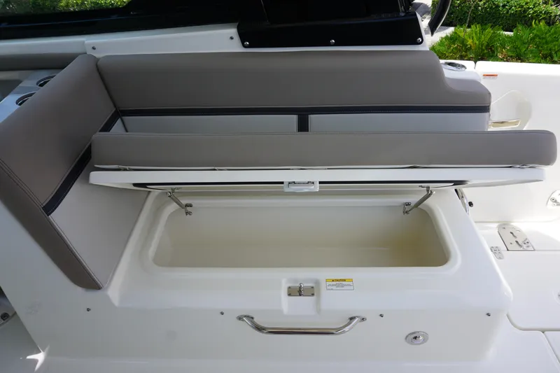 Slide: The Image of 2025 Boston Whaler 330 Vantage boat seat with storage compartment open. - 36