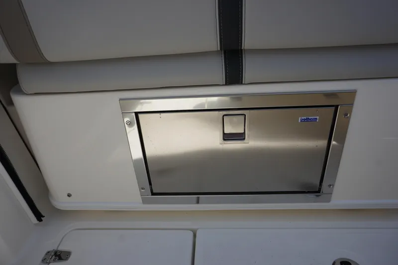 Slide: The Image of Stainless steel storage compartment on 2025 Boston Whaler 330 Vantage boat. - 40