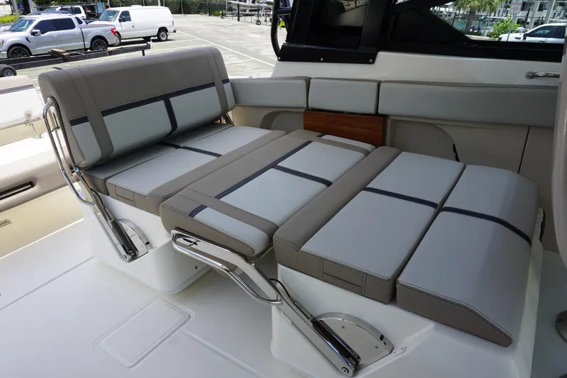 Slide: The Image of 2025 Boston Whaler 330 Vantage boat seating area with adjustable cushions. - 42