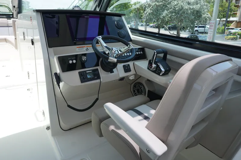 Slide: The Image of 2025 Boston Whaler 330 Vantage helm with modern controls and navigation system. - 46
