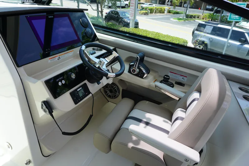 Slide: The Image of 2025 Boston Whaler 330 Vantage helm with modern controls and comfortable seating. - 47