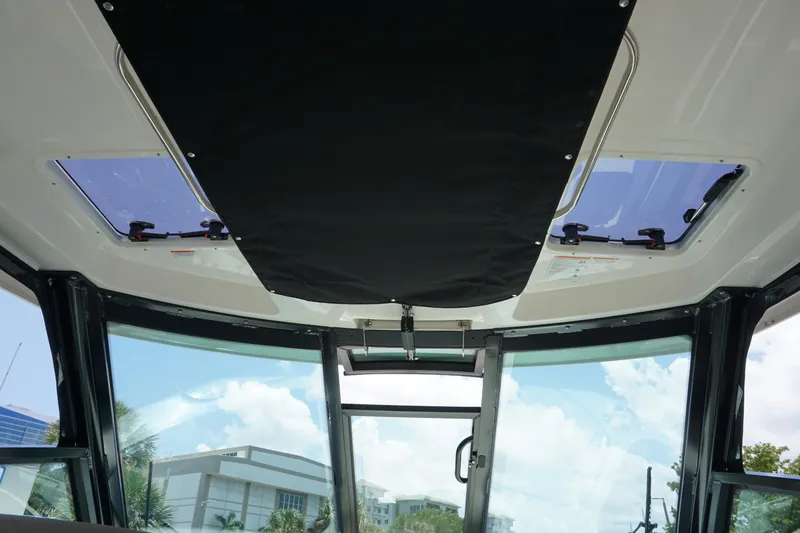 Slide: The Image of Interior view of 2025 Boston Whaler 330 Vantage boat with skylights and modern design. - 53