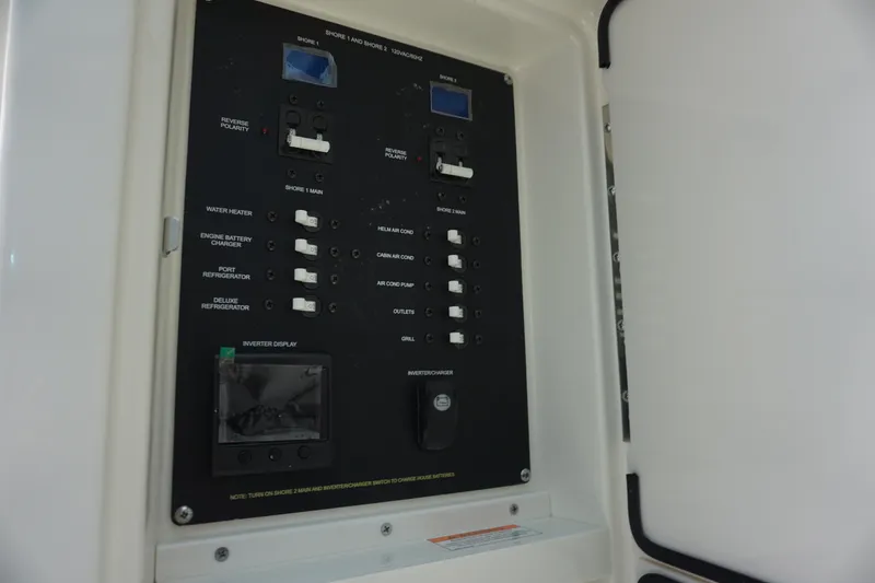 Slide: The Image of Electrical control panel on a 2025 Boston Whaler 330 Vantage boat. - 58