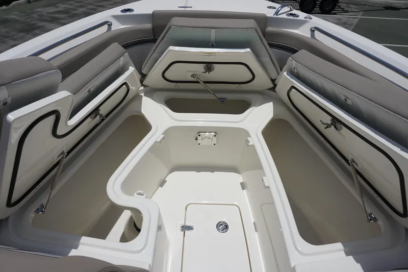 Slide: The Image of 2025 Boston Whaler 330 Vantage boat with open storage compartments and seating. - 70