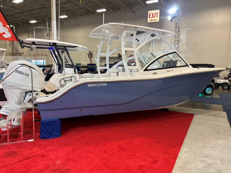 The Image of 2025 Sea Fox 268 Traveler boat displayed indoors on red carpet. - 0