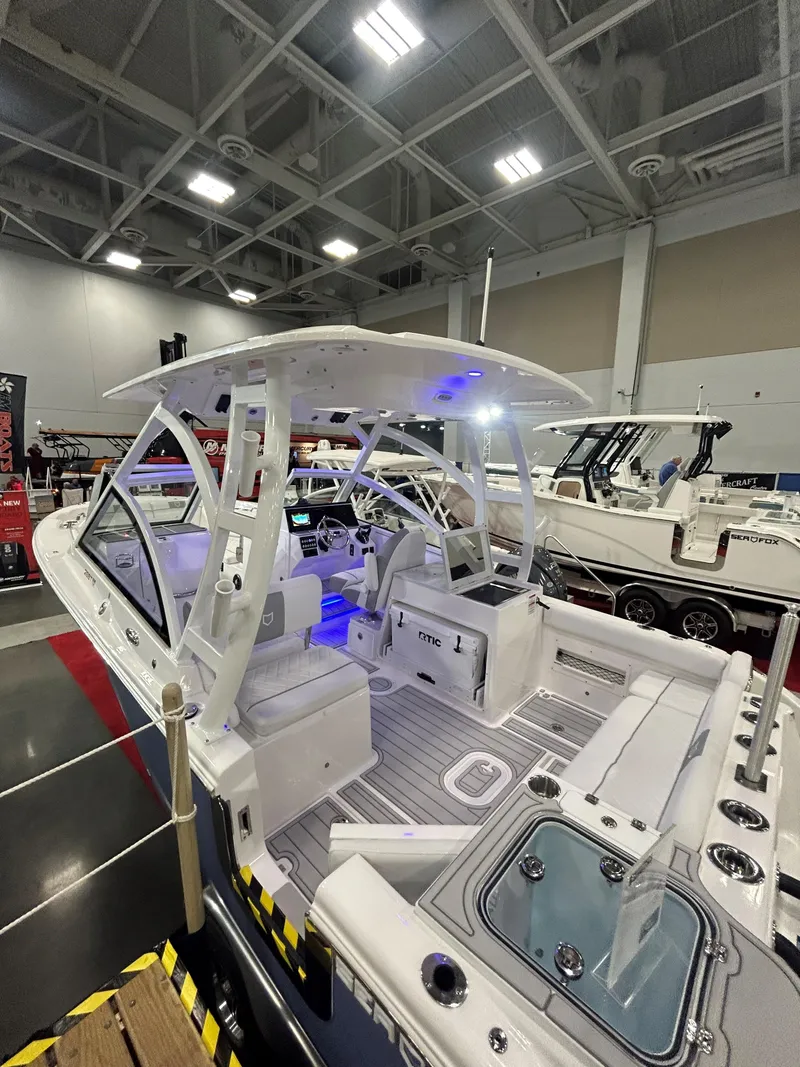 Slide: The Image of 2025 Sea Fox 268 Traveler boat interior with modern seating and blue LED lighting. - 12