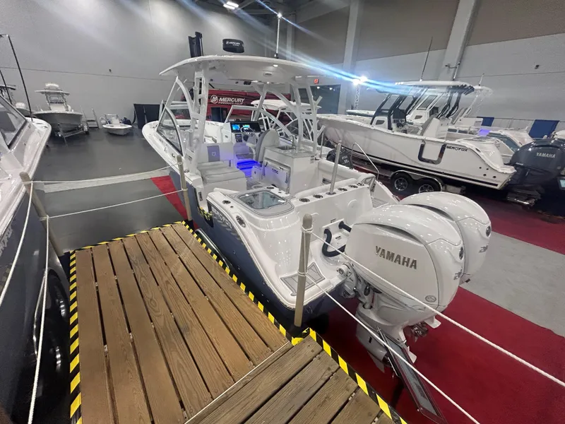 Slide: The Image of 2025 Sea Fox 268 Traveler boat with Yamaha engines displayed indoors. - 17