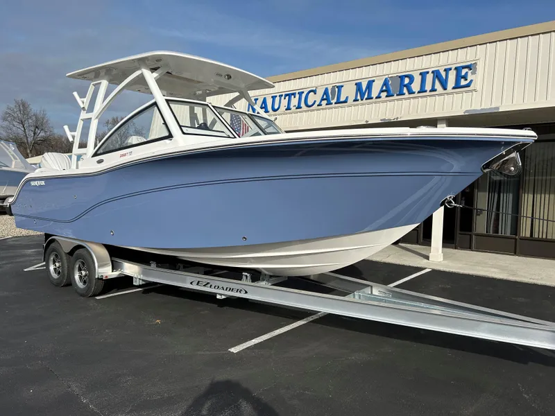 Slide: The Image of 2025 Sea Fox 268 Traveler boat on trailer at Nautical Marine dealership. - 2