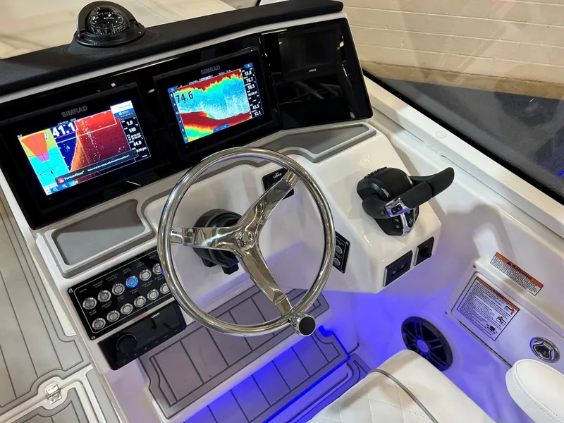 Slide: The Image of 2025 Sea Fox 268 Traveler dashboard with advanced navigation displays and controls. - 24