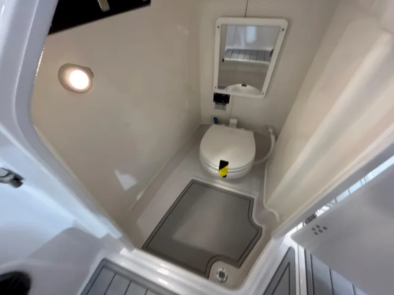 Slide: The Image of Interior of 2025 Sea Fox 268 Traveler boat bathroom with toilet and mirror. - 26
