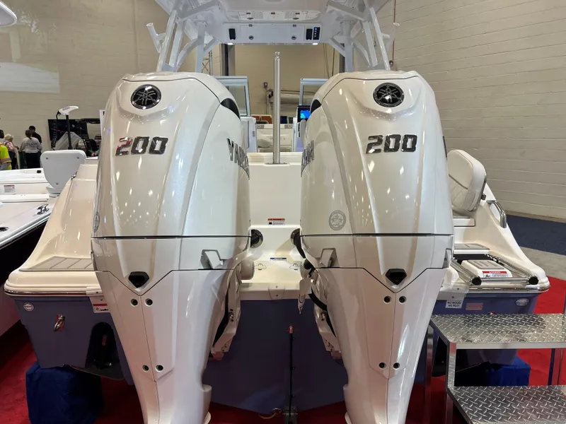 Slide: The Image of 2025 Sea Fox 268 Traveler with twin 200 horsepower engines displayed indoors. - 28