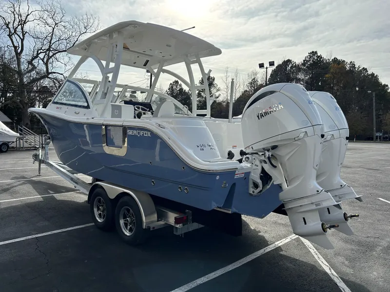 Slide: The Image of 2025 Sea Fox 268 Traveler boat with twin Yamaha engines on a trailer. - 5