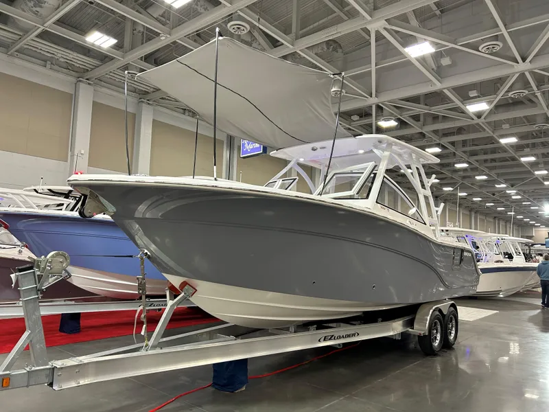 The Image of 2025 Sea Fox 288 Traveler boat displayed indoors on a trailer. - 0