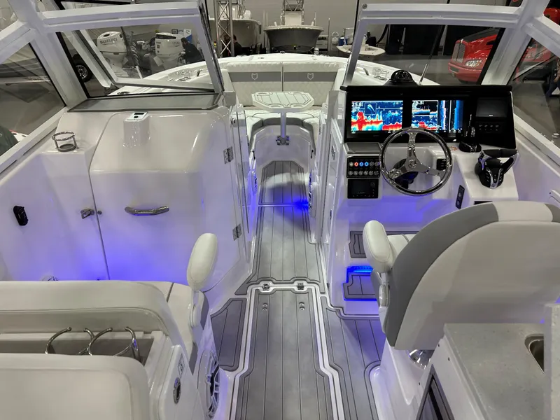 Slide: The Image of 2025 Sea Fox 288 Traveler boat interior with modern dashboard and seating. - 6