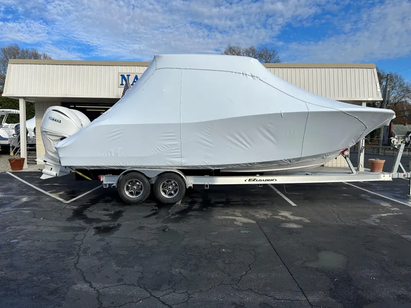 Slide: The Image of 2025 Sea Fox 288 Traveler boat covered on trailer in parking lot. - 8