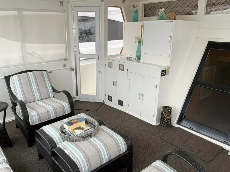 Slide: The Image of Luxurious interior of 2000 Novatec Islander 55 yacht with elegant seating and decor. - 11