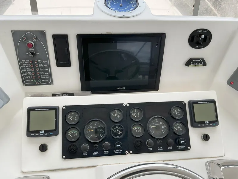 Slide: The Image of Control panel of a 2000 Novatec Islander 55 yacht with gauges and navigation equipment. - 18