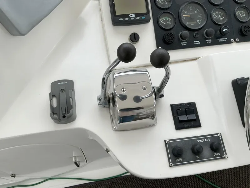 Slide: The Image of Control panel of a 2000 Novatec Islander 55 yacht with throttle levers and gauges. - 19