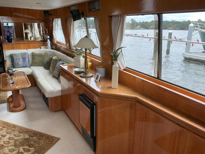 Slide: The Image of Luxurious interior of 2000 Novatec Islander 55 yacht with elegant wood finish and waterfront view. - 25
