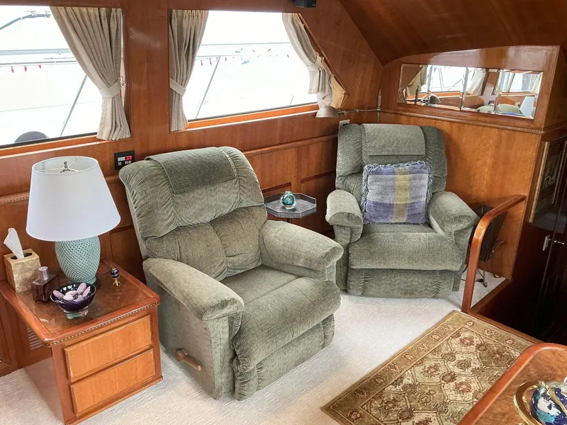 Slide: The Image of Cozy interior of 2000 Novatec Islander 55 with plush armchairs and wooden accents. - 27