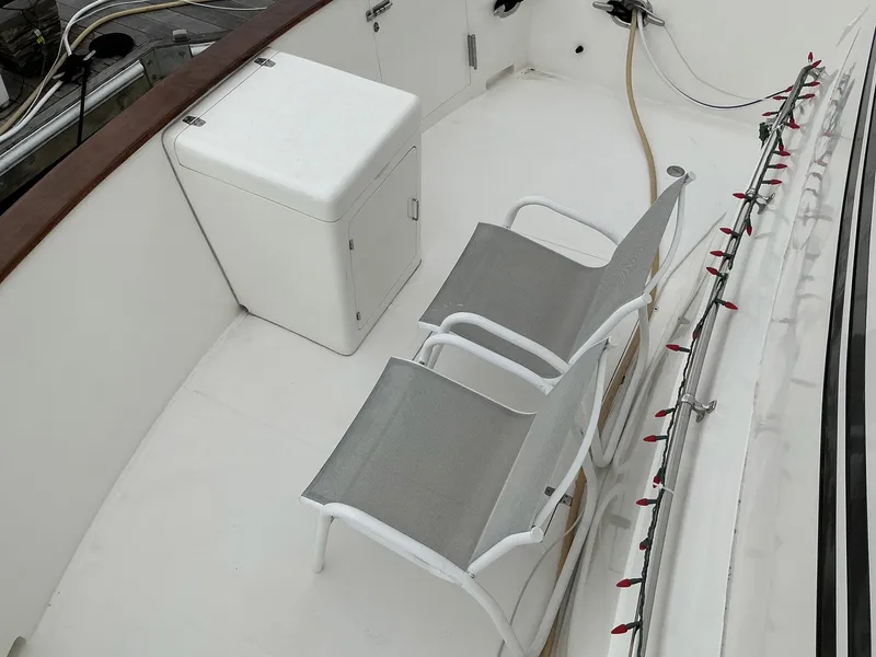 Slide: The Image of Deck of 2000 Novatec Islander 55 with chairs and storage box. - 3