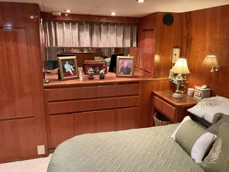 Slide: The Image of Luxurious bedroom interior of 2000 Novatec Islander 55 yacht with wood paneling and decor. - 31