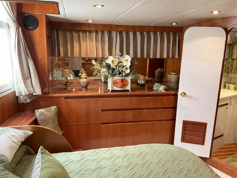 Slide: The Image of Luxurious cabin interior of 2000 Novatec Islander 55 yacht with elegant wood finish. - 33