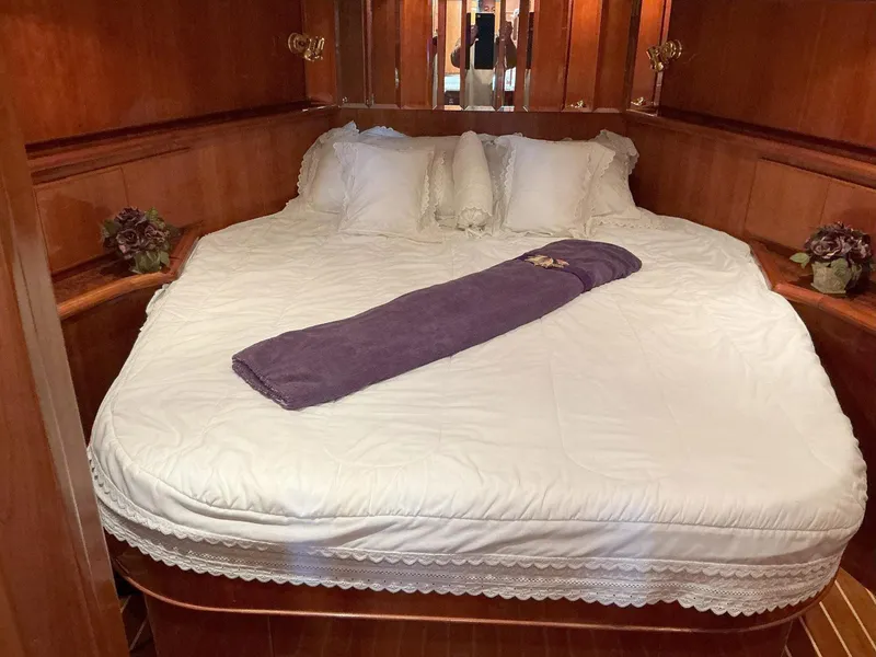 Slide: The Image of Luxurious bedroom in 2000 Novatec Islander 55 yacht with elegant bedding. - 34