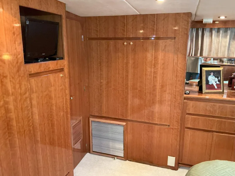 Slide: The Image of Interior of 2000 Novatec Islander 55 yacht with wood paneling and built-in TV. - 37