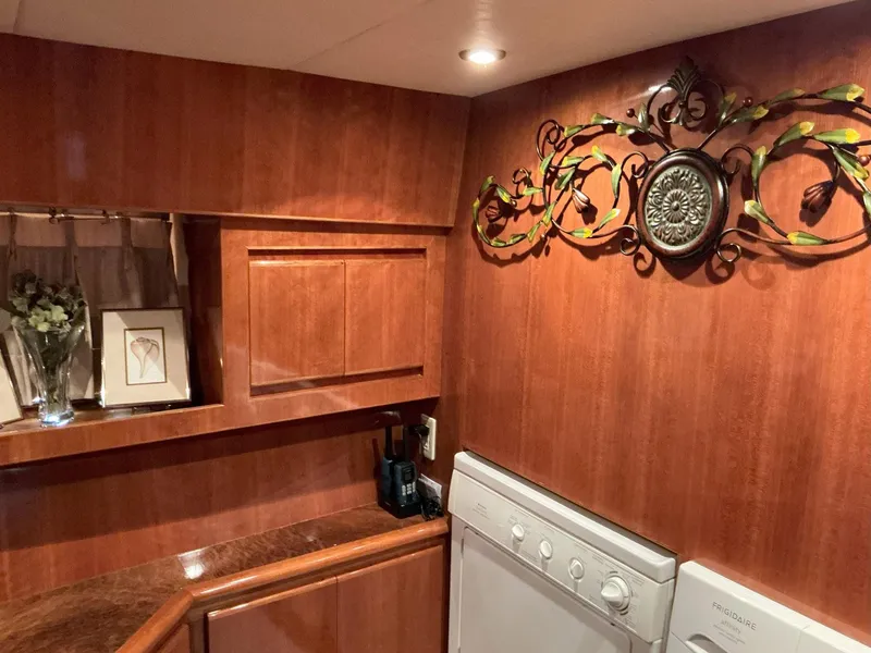 Slide: The Image of Luxurious wood-paneled interior of 2000 Novatec Islander 55 yacht with decorative wall art. - 41