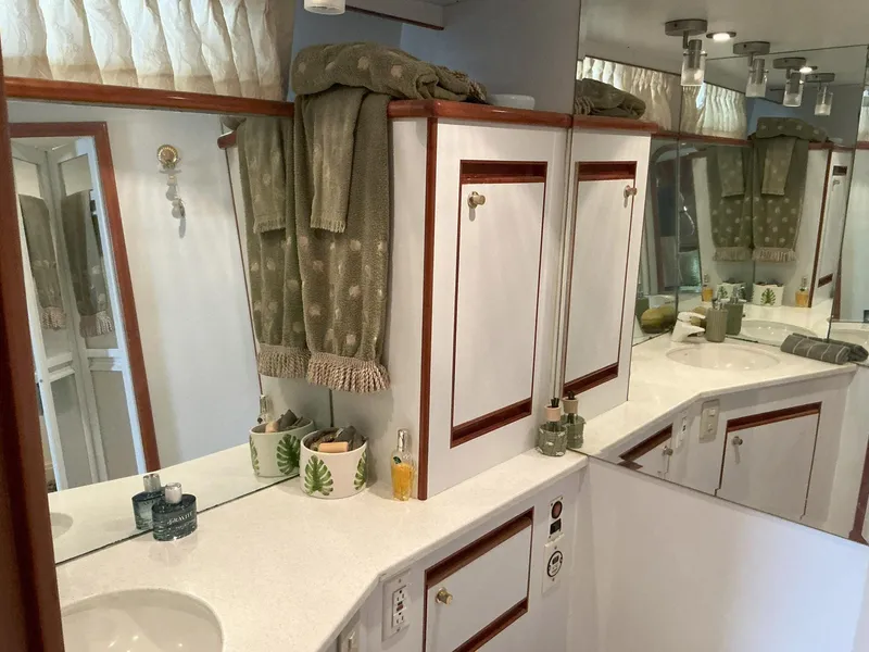 Slide: The Image of Novatec Islander 55 yacht bathroom, 2000 model, featuring elegant cabinetry and mirrored surfaces. - 46