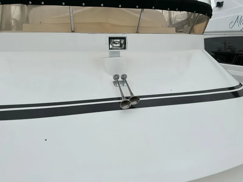 Slide: The Image of Novatec Islander 55 yacht, 2000 model, featuring sleek white deck and dual horns. - 7