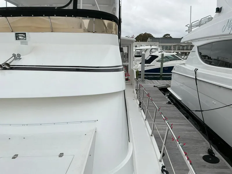 Slide: The Image of Novatec Islander 55 yacht docked at marina, side view, 2000 model. - 8