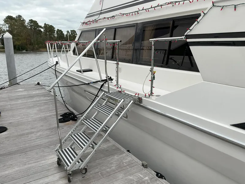 Slide: The Image of Novatec Islander 55 yacht docked with metal boarding stairs, 2000 model. - 9